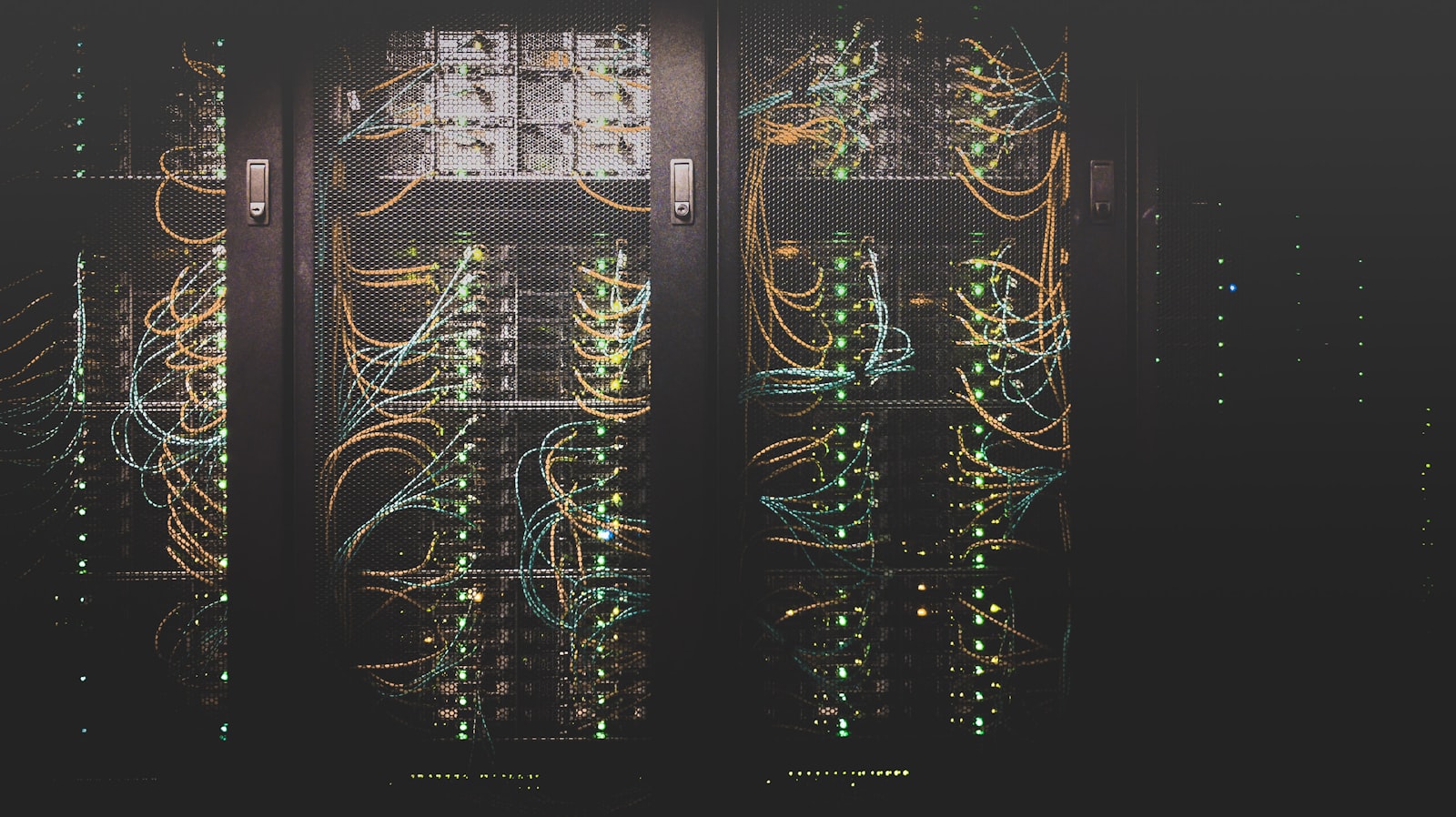 Server racks in a data center with blue status lighting